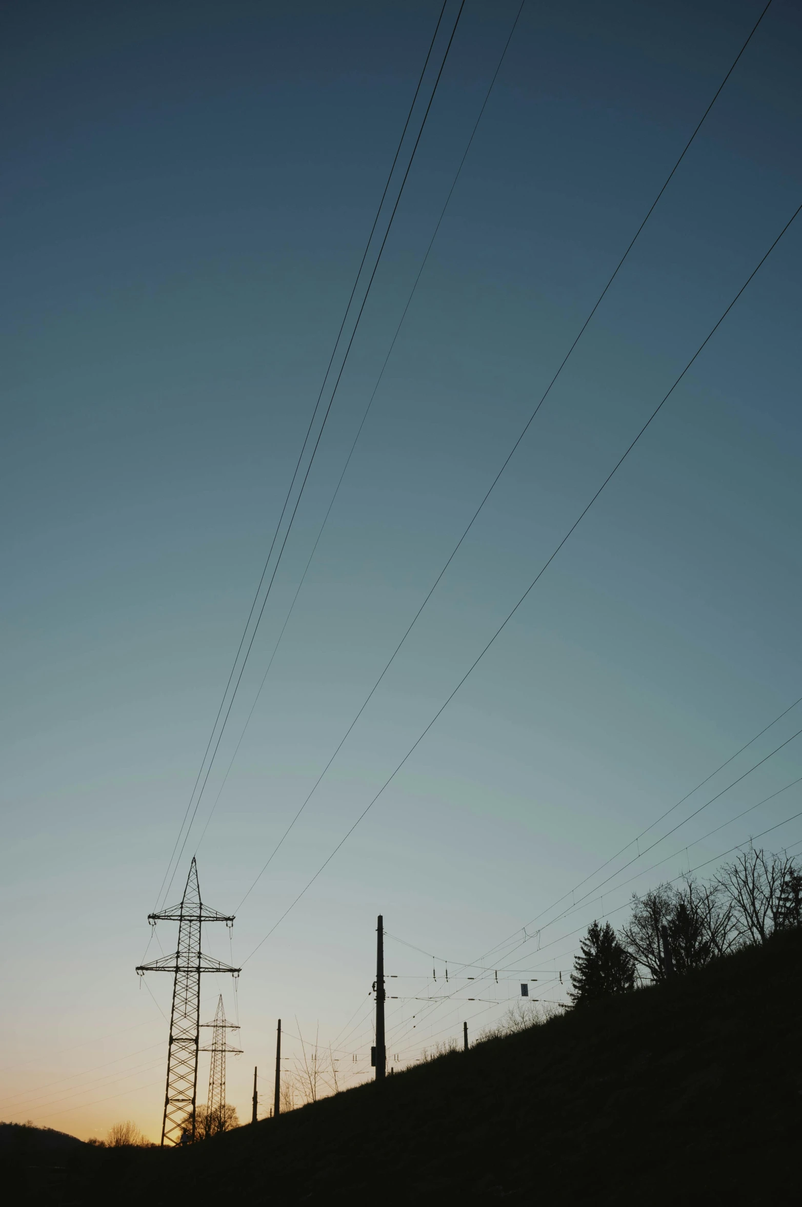 the power lines are high above a hill