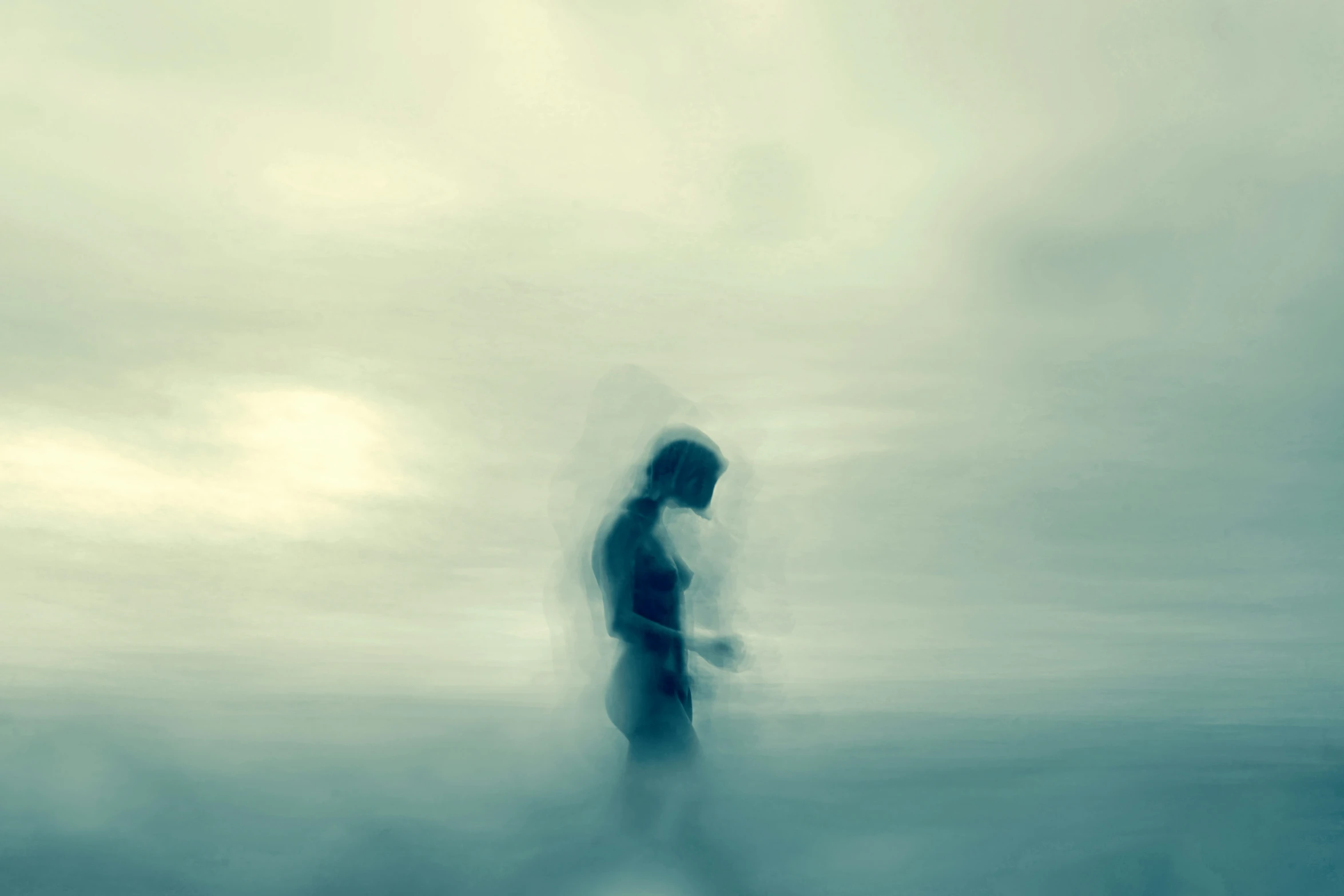 blurred pograph of a man standing alone