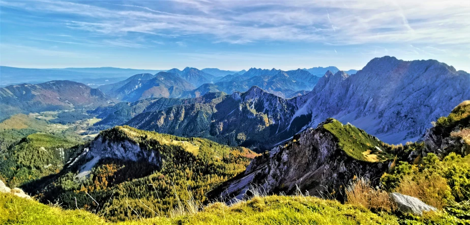 a couple of mountains with some bushes on the other side