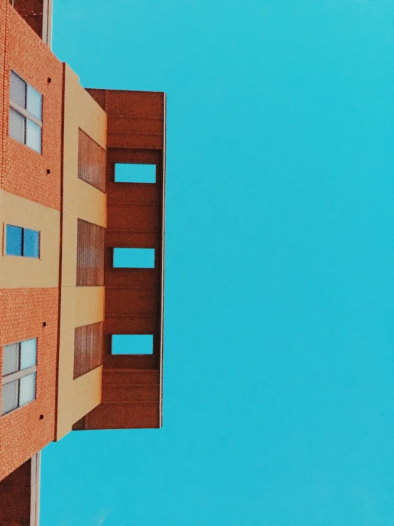 a view of a very tall building from below