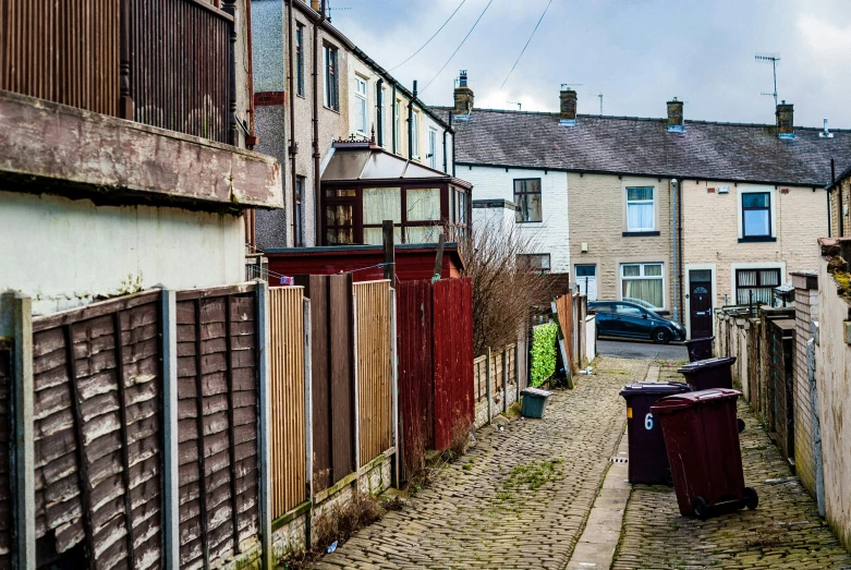 an old alleyway is shown with lots of trash