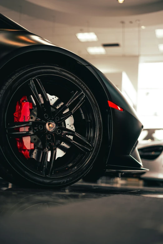 a car in a car showroom with black tires