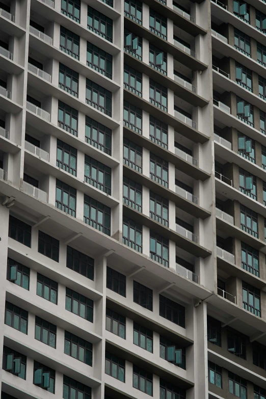 a clock on the side of a very tall building