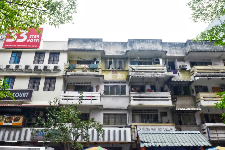 a tall building is next to a row of buildings