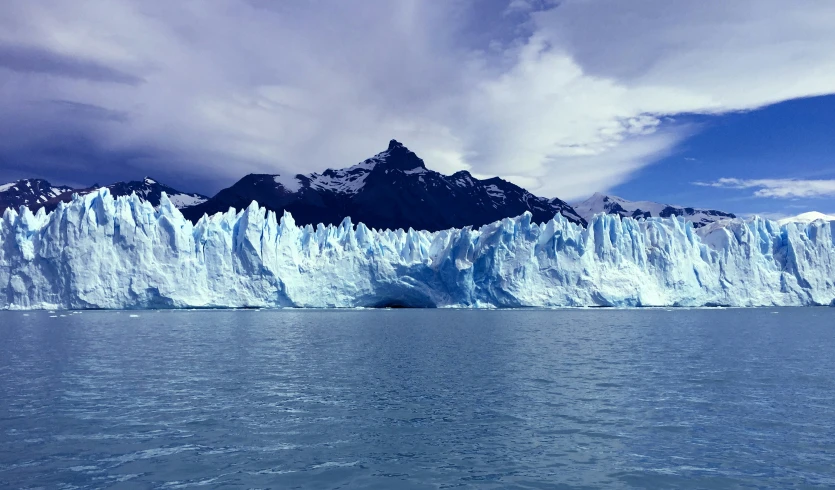 iceberg in the ocean is visible from a boat