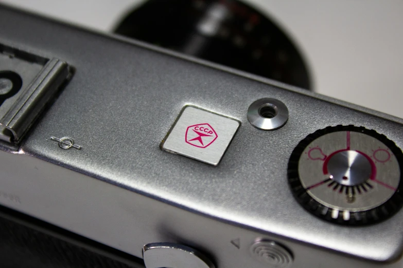 a close - up of a silver camera's ons