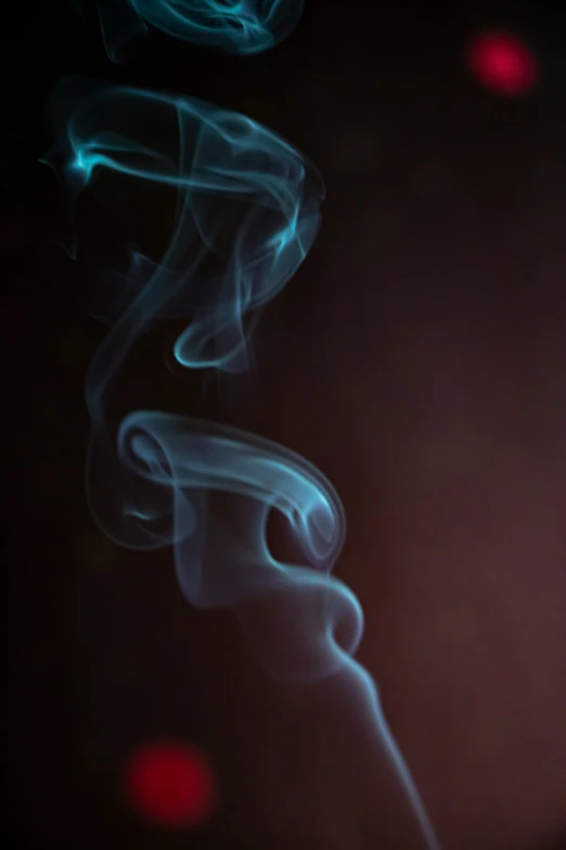 a green and blue object that looks like smoke