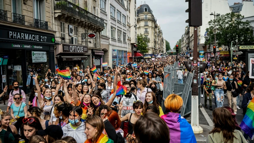 a large group of people are walking on the street