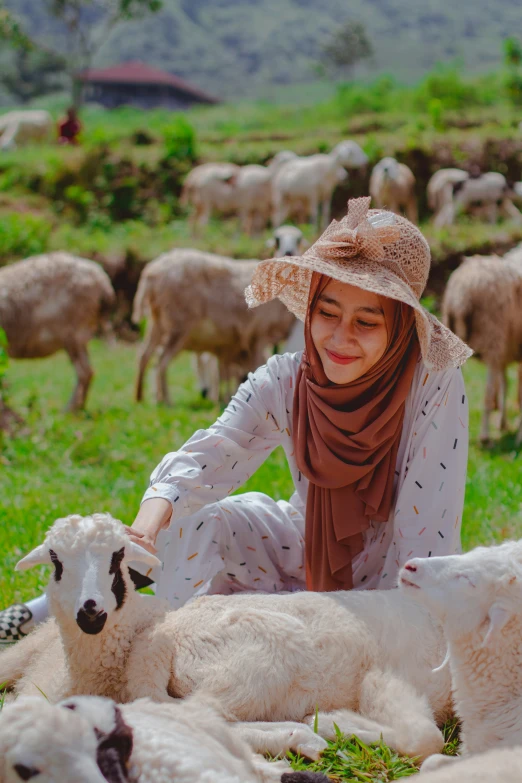  with hat, scarf and sheep lying down