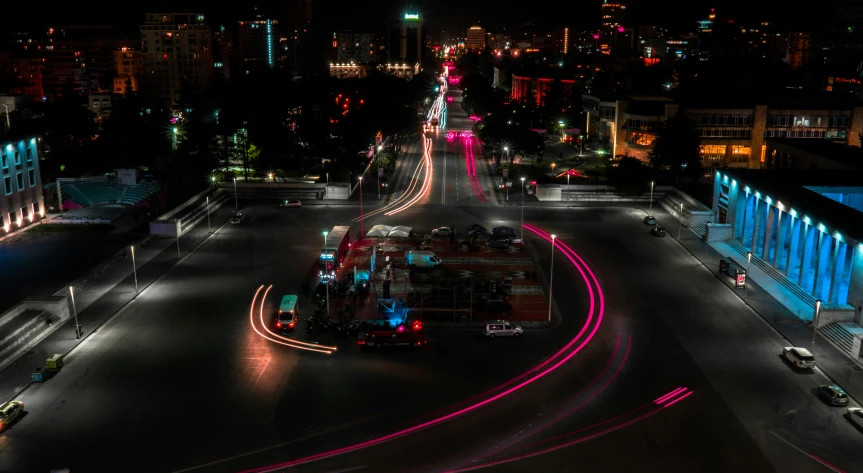 a city with cars and traffic at night