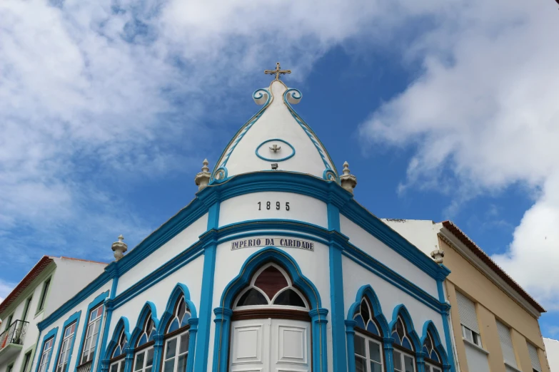 an ornate building with arched doorways and a clock tower