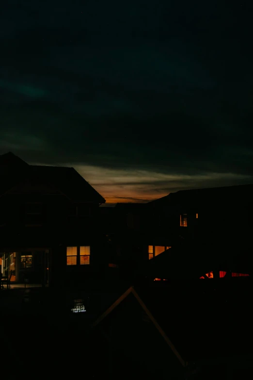 the view of houses lit up at night