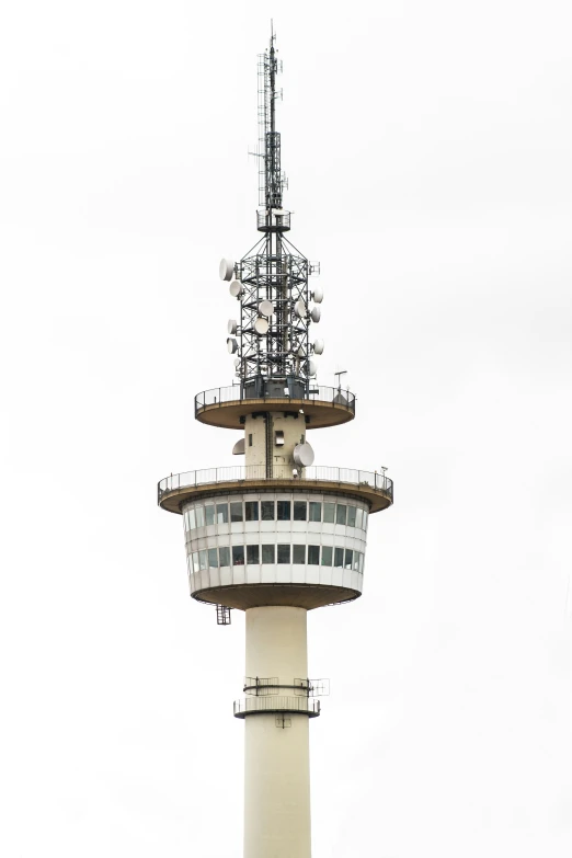 an air traffic control tower next to an airplane