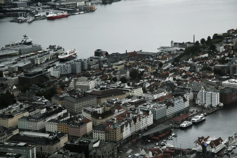 an aerial view of city with a harbor in the foreground