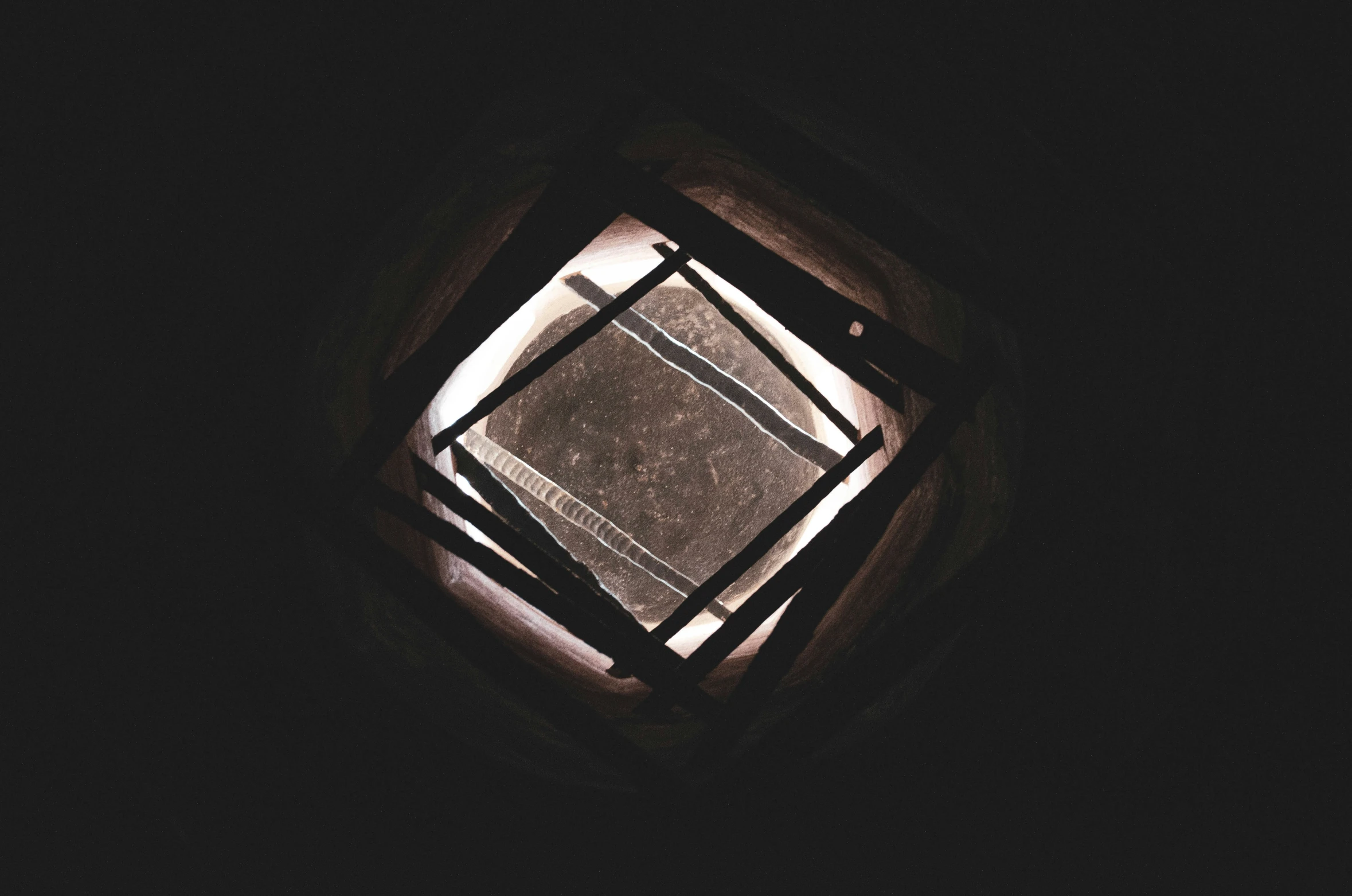 a square picture sitting in the middle of a window