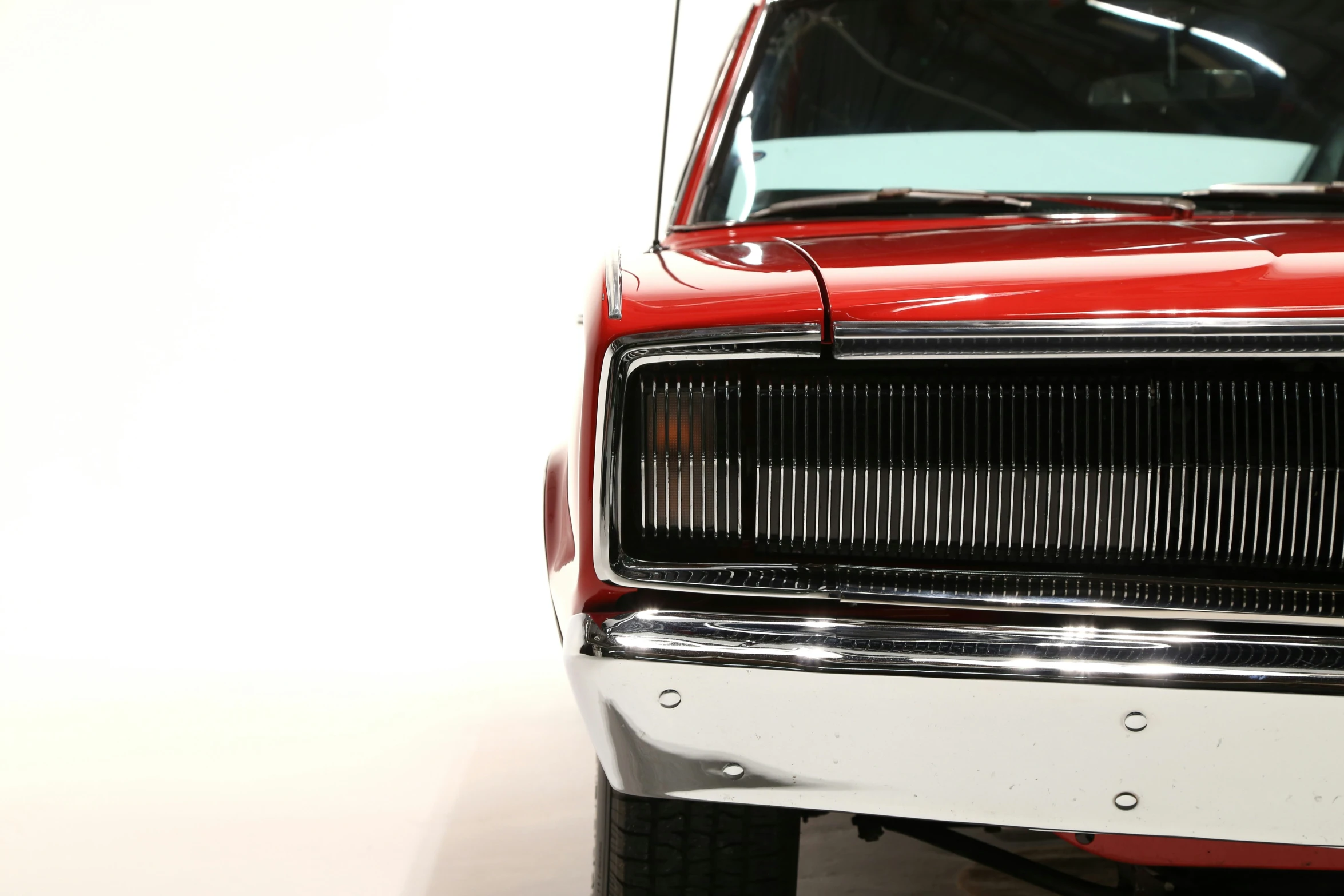 a red and white truck with a grill cover