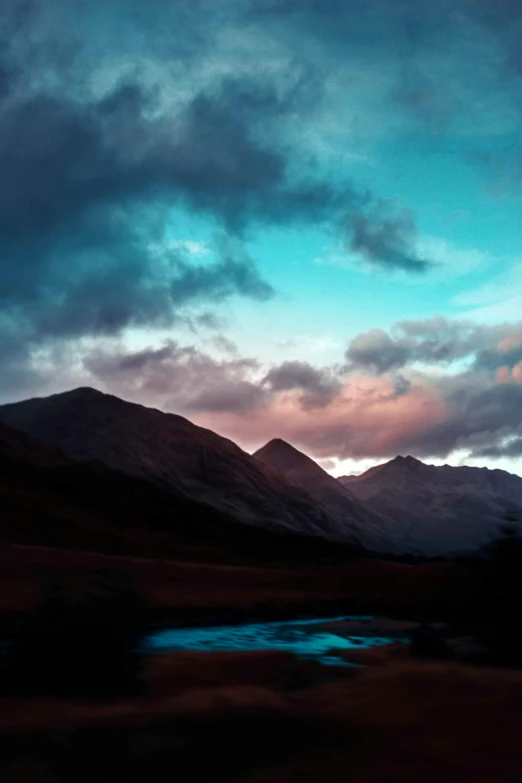 a large long view of a mountain with water