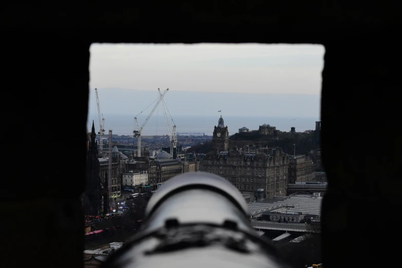 there is a view from the window looking towards an urban area