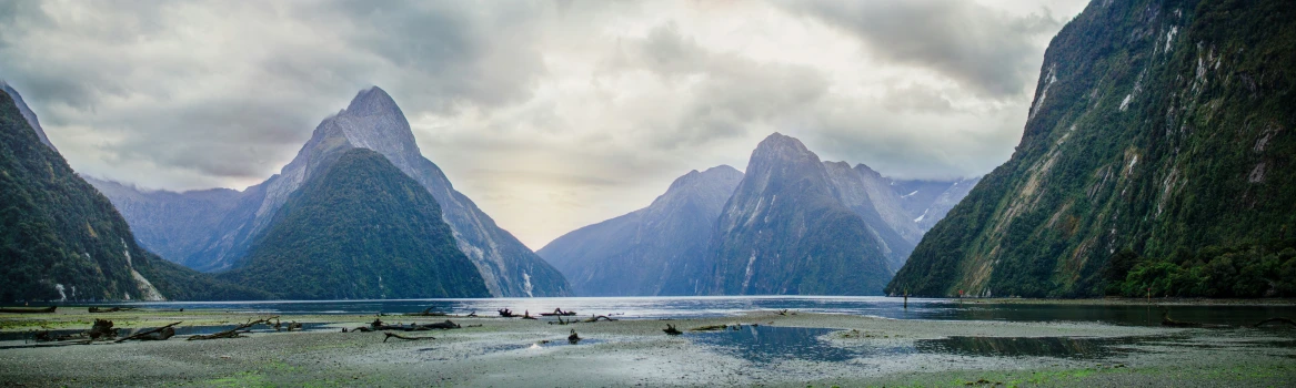 a landscape s with people and mountains in the background