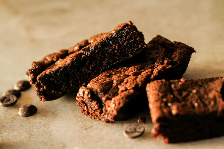 brownies with chocolate chips on a white table