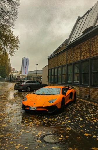 a orange car is on the street with its hood turned