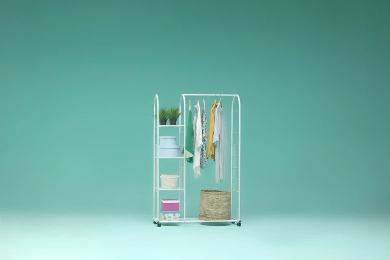 a clothing rack holds many items while hanging on a rack