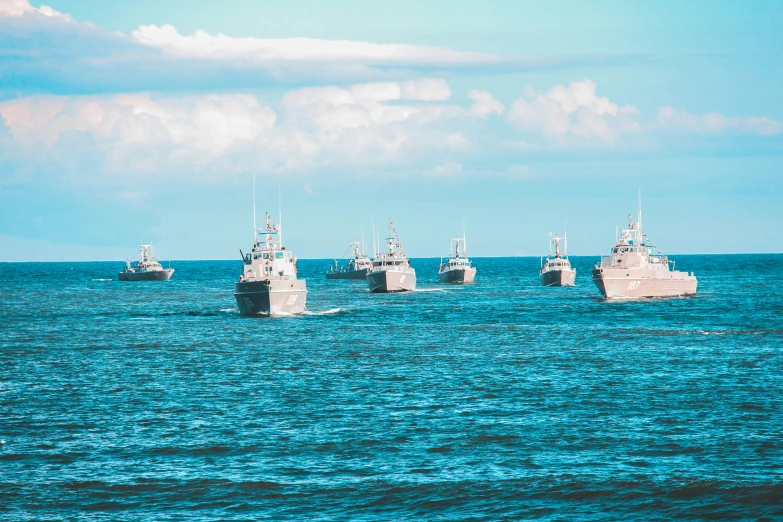 the fleet of boats are lined up in the blue water