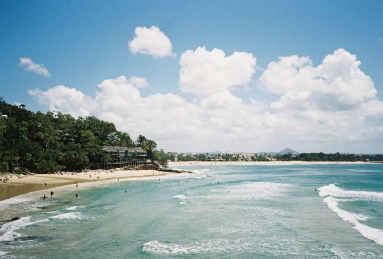 waves are coming in on a tropical beach