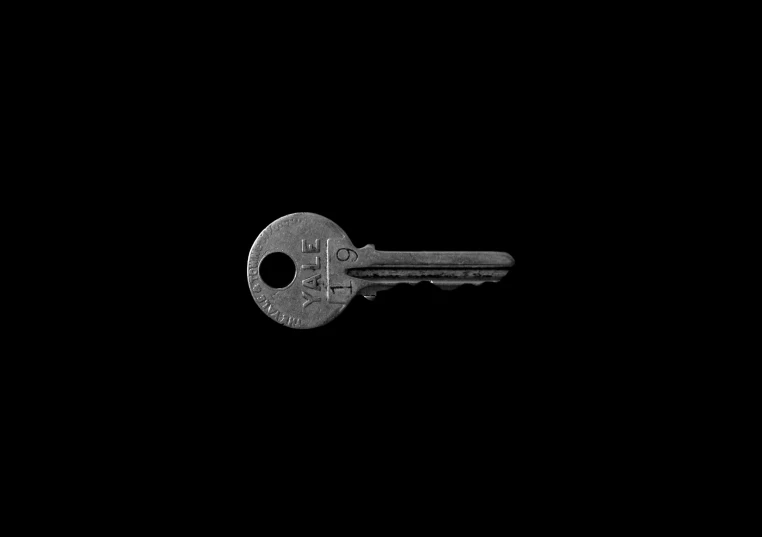 a black key sitting in the dark