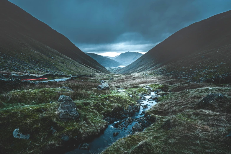 a pograph of some water in the mountains