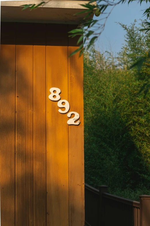 the number 898 on a wooden building