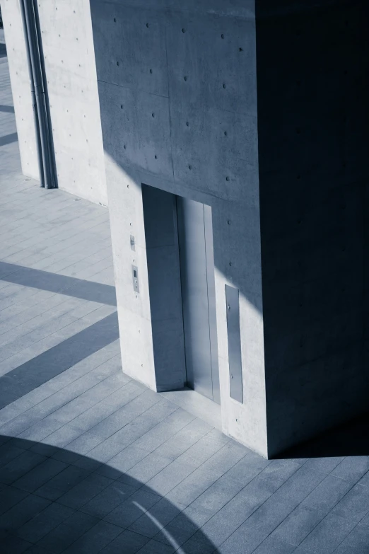 the corner of a concrete building with lines drawn on it