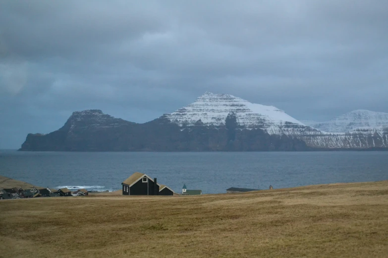 a small hut near a large body of water