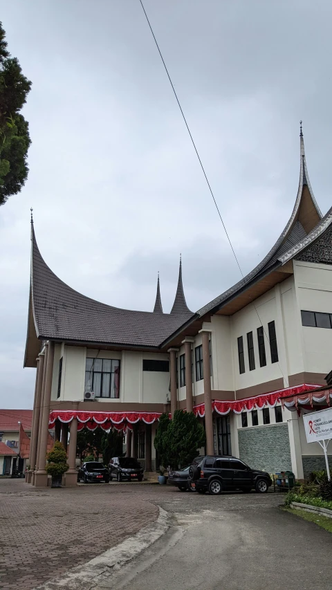 a large white building with a very high roof