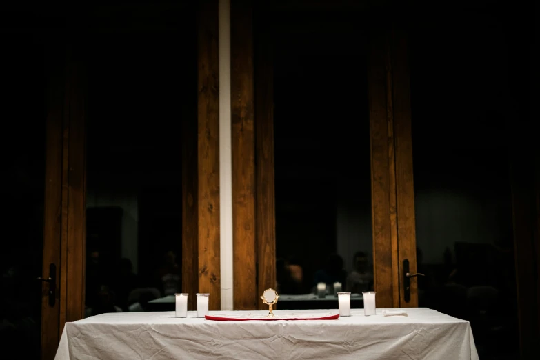 a table topped with a white cloth covered table