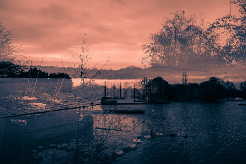 the sky is dark and the clouds are almost obscured by water