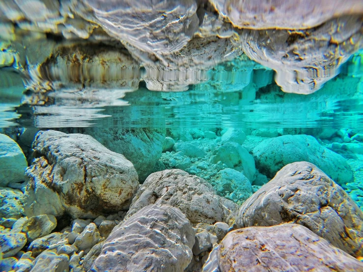 an underwater po of rocks and water