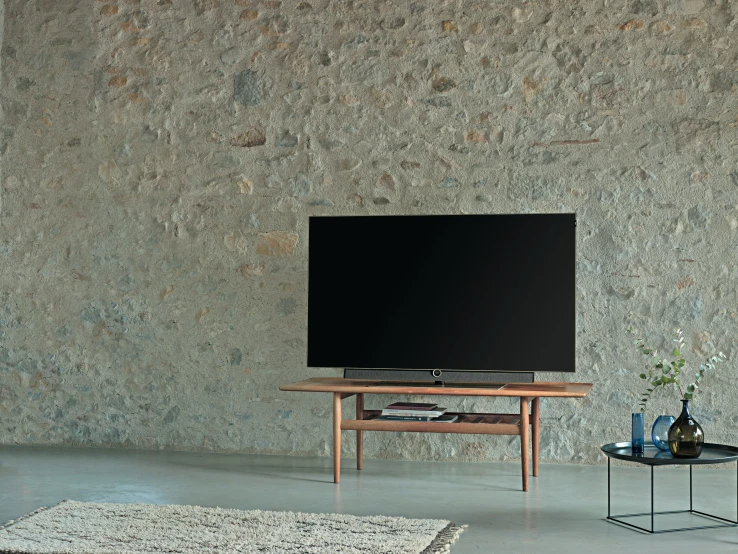 a room with a large television sitting on a stand