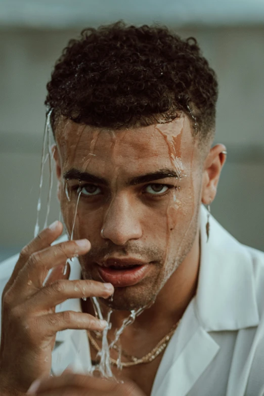 a young man shaving with only one hand