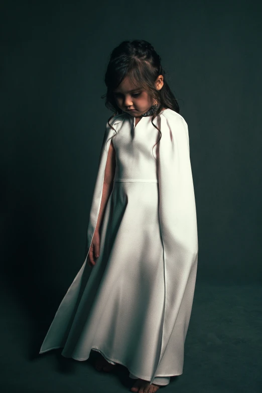 an asian girl in a long white dress