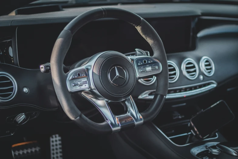 the steering wheel and dash console in a mercedes c - class