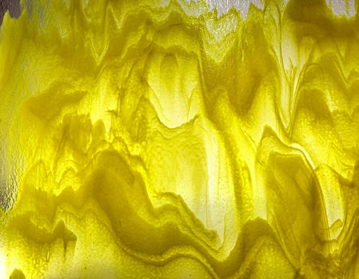 a yellow piece of cloth with water dripping out of it