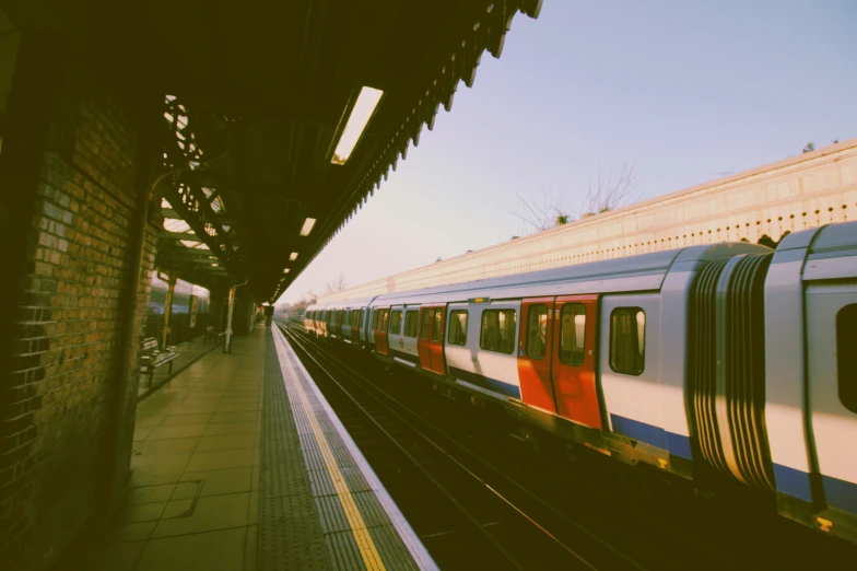 a train is parked next to a subway platform