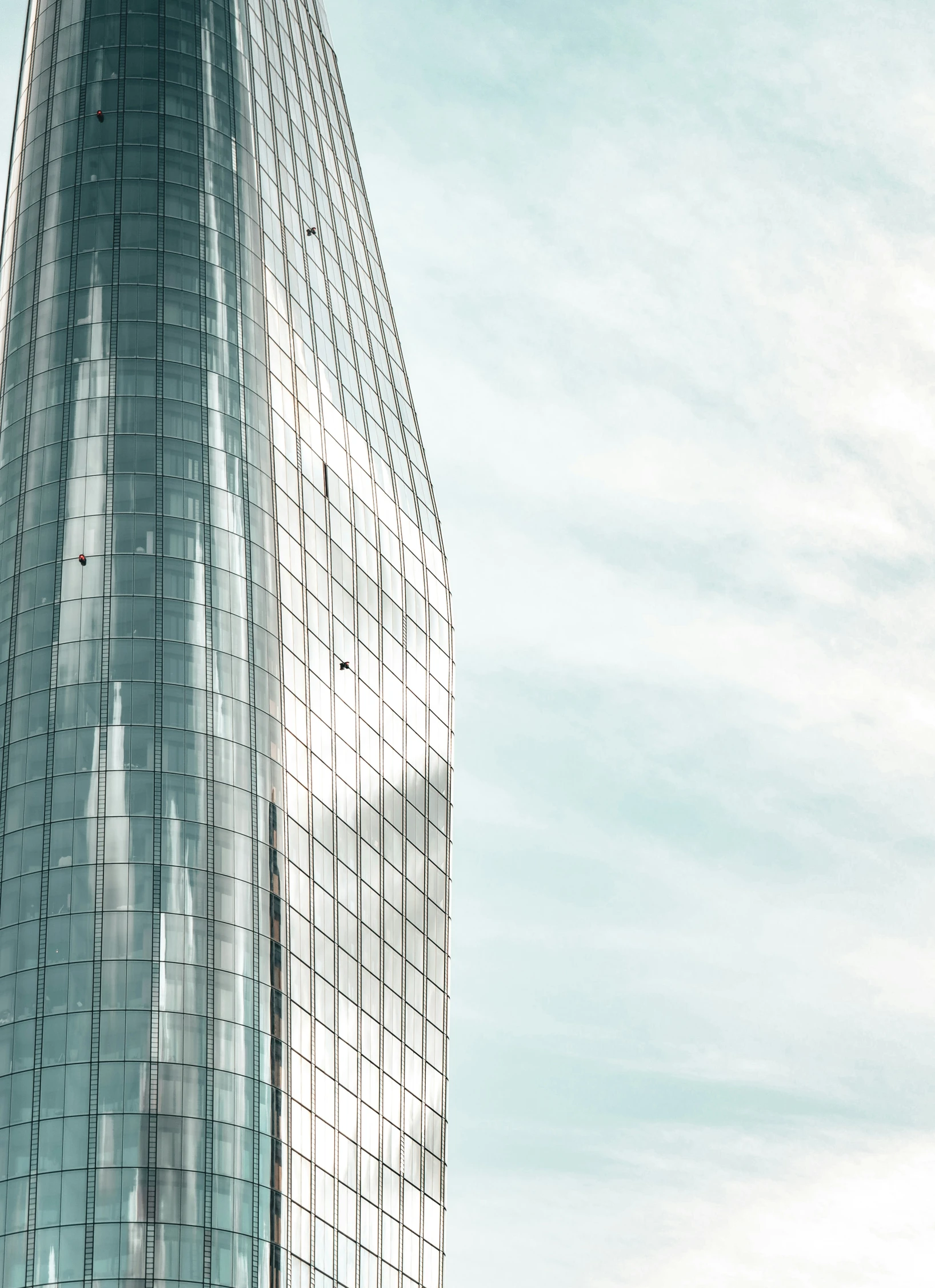 the facade of an office building with very low angle view