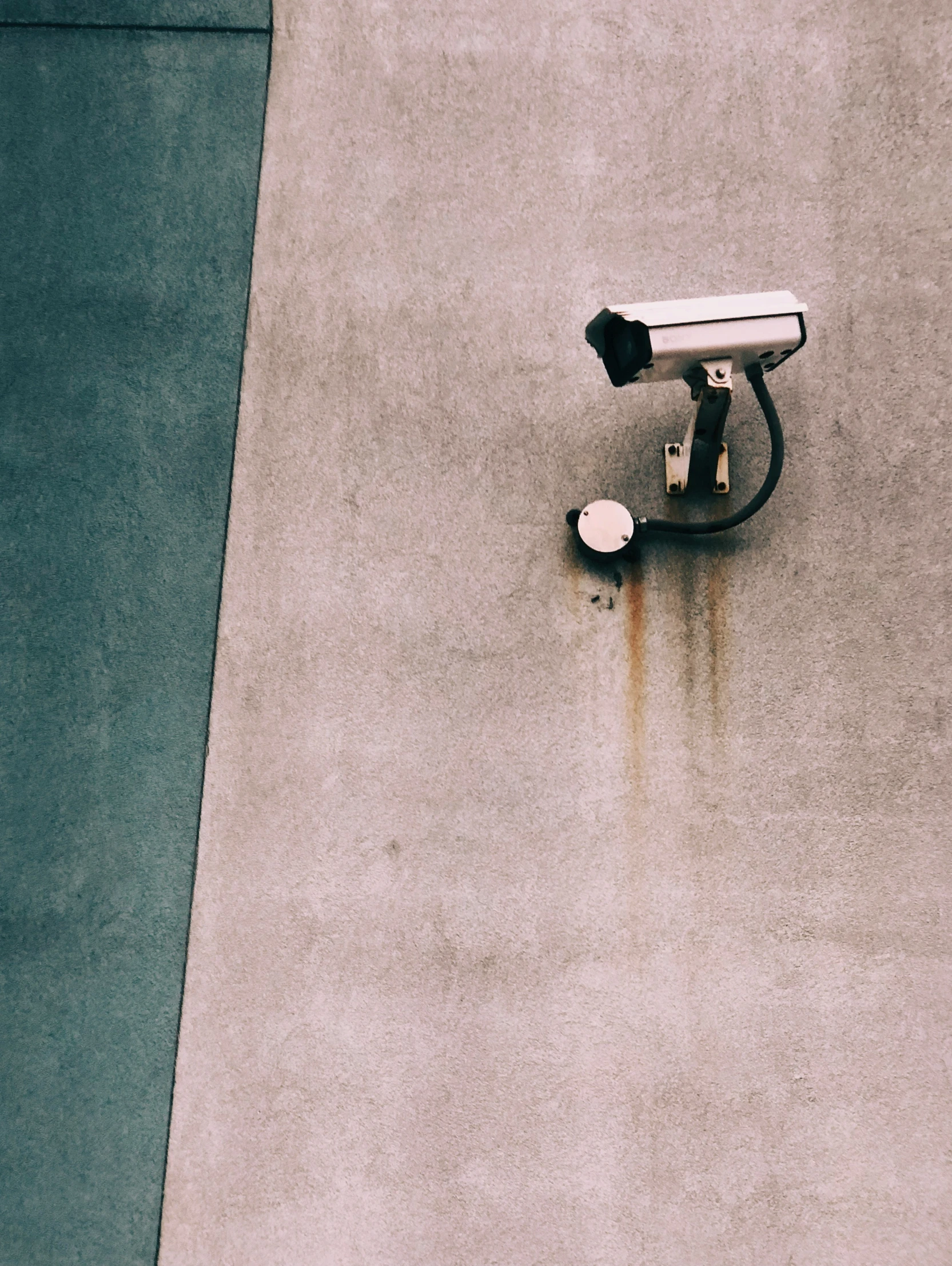 a small camera sits outside of a building