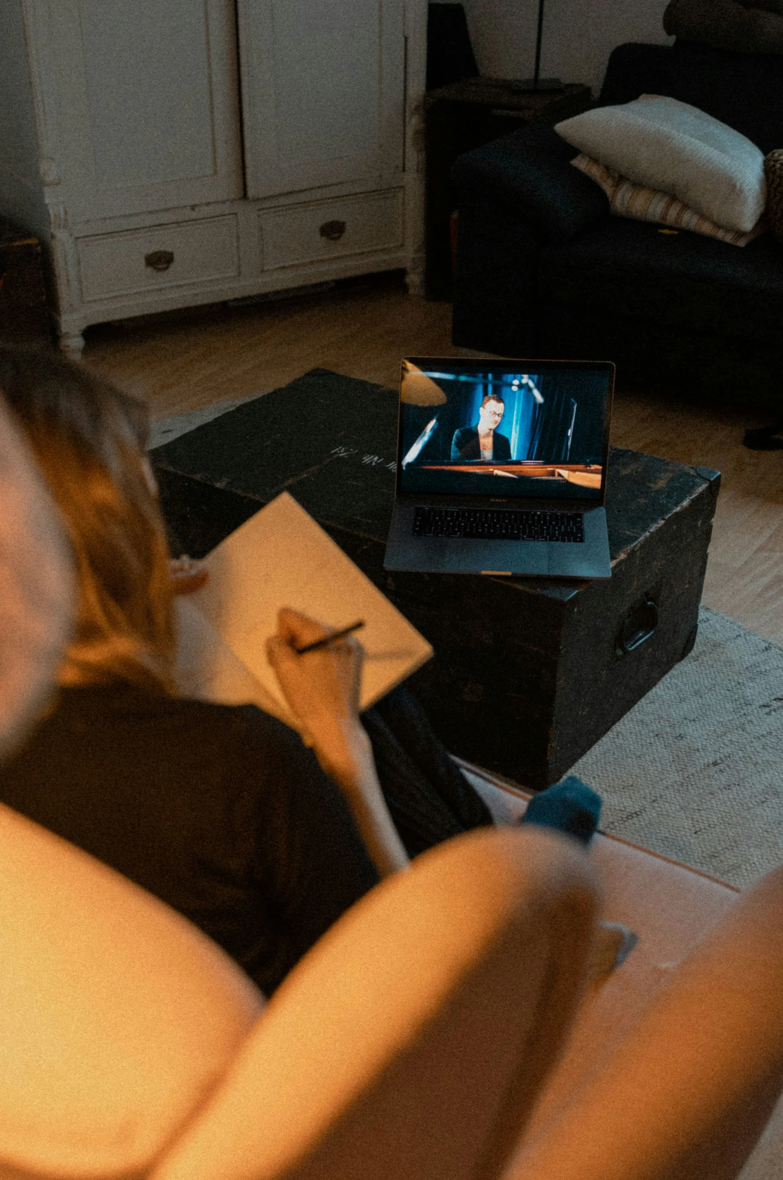 a person watching a television in their living room