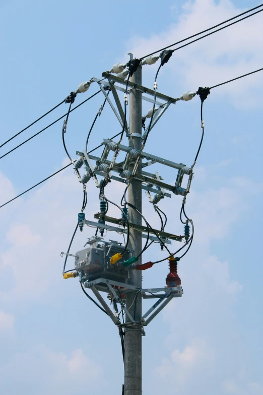 the utility pole is full of cables and wires