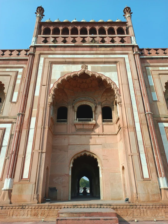 a large tower that has a door and a walkway