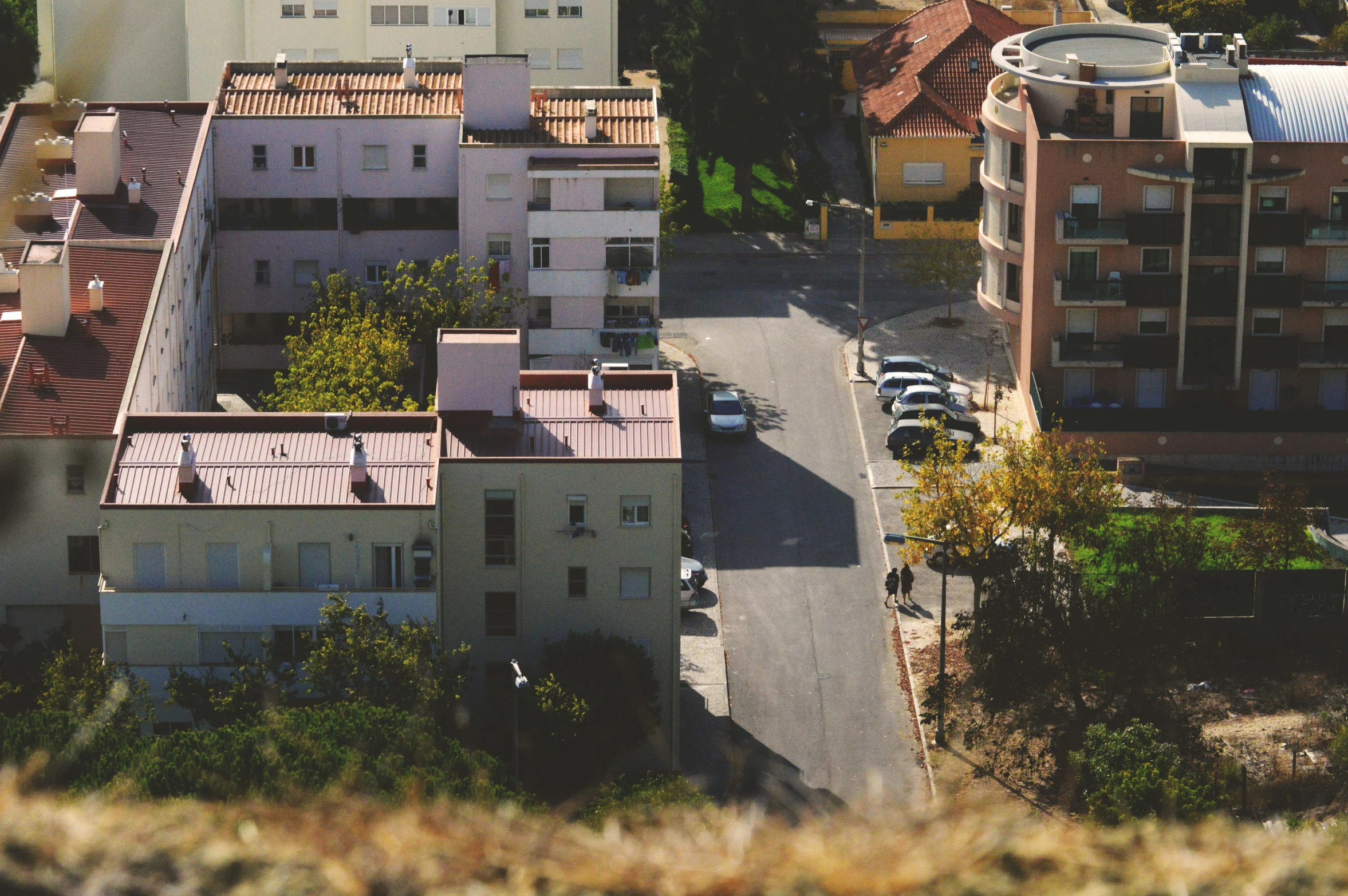 a small parking lot next to many large buildings