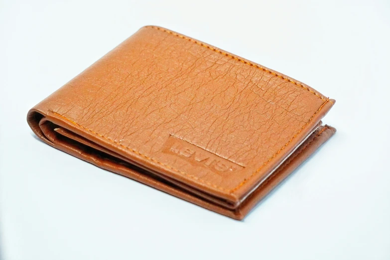 a brown leather wallet with no money